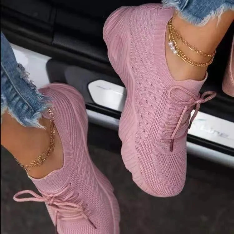 Women's lace-up walking sneakers with textured uppers and ridged flat soles