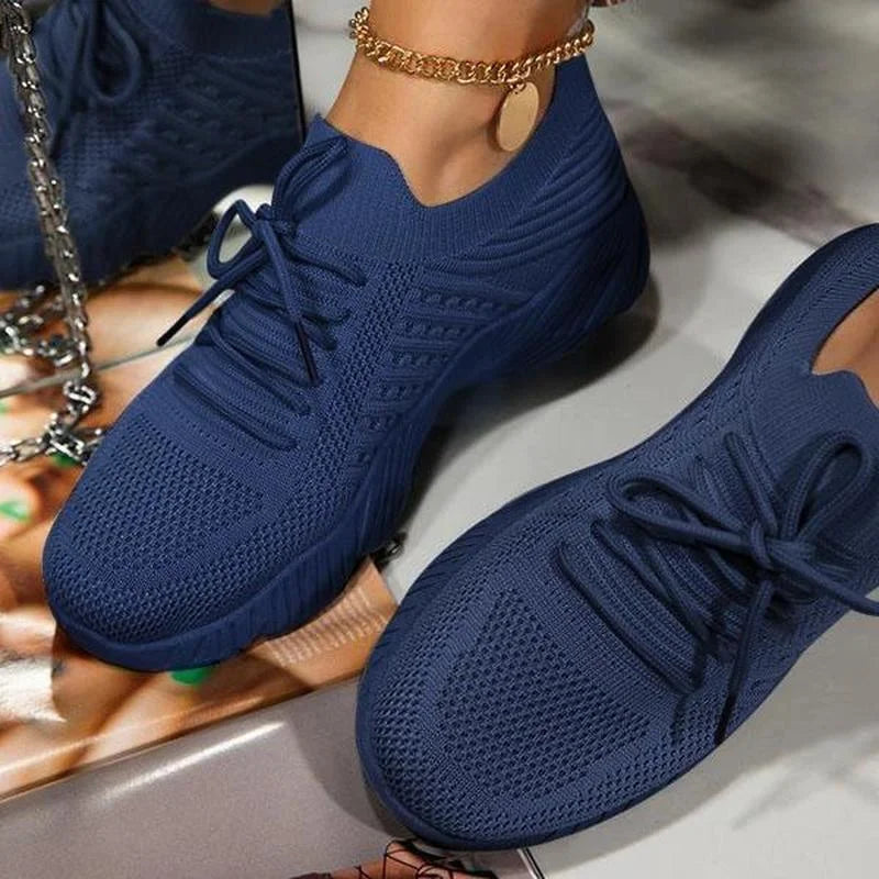 Women's lace-up walking sneakers with textured uppers and ridged flat soles
