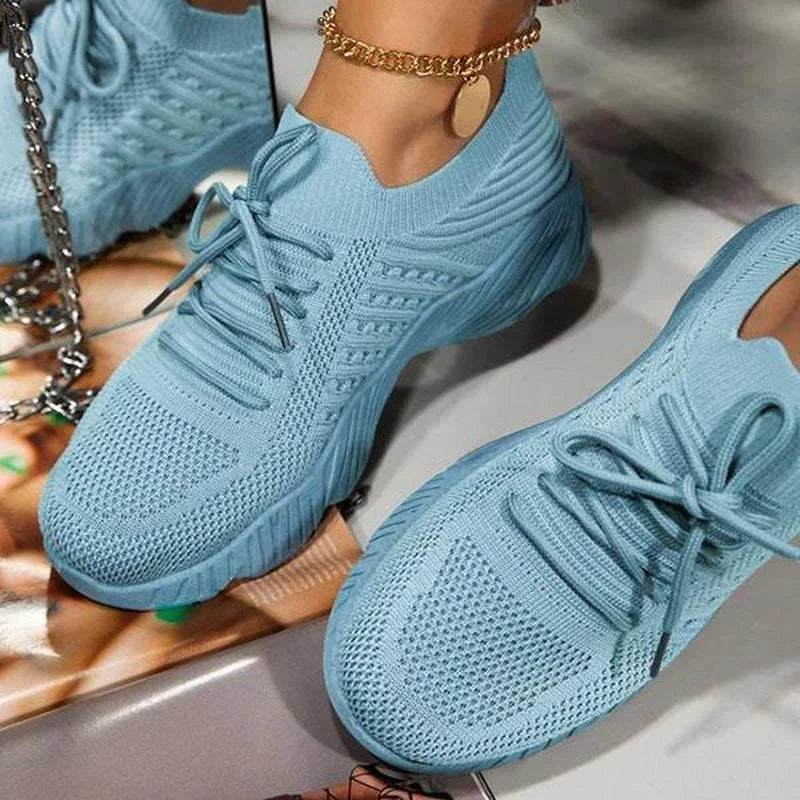 Women's lace-up walking sneakers with textured uppers and ridged flat soles