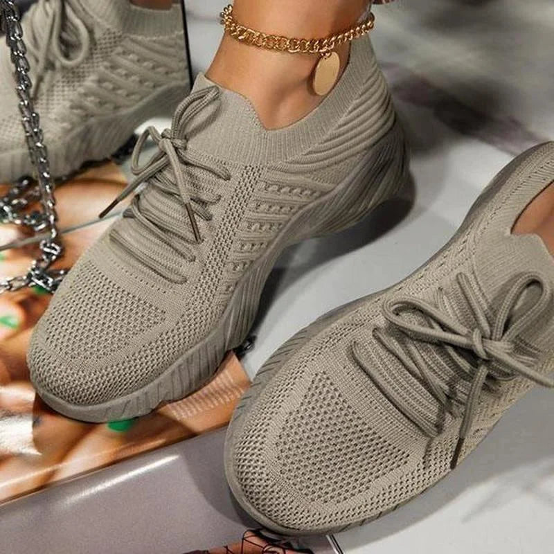 Women's lace-up walking sneakers with textured uppers and ridged flat soles