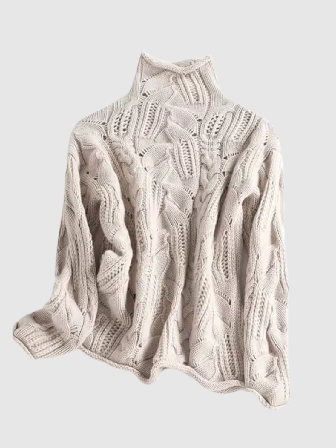 Cable knit turtleneck sweater with long sleeves and textured detailing