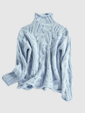 Cable knit turtleneck sweater with long sleeves and textured detailing