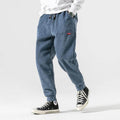 Men's relaxed corduroy jogger trousers with elasticated cuffs and drawstring waist