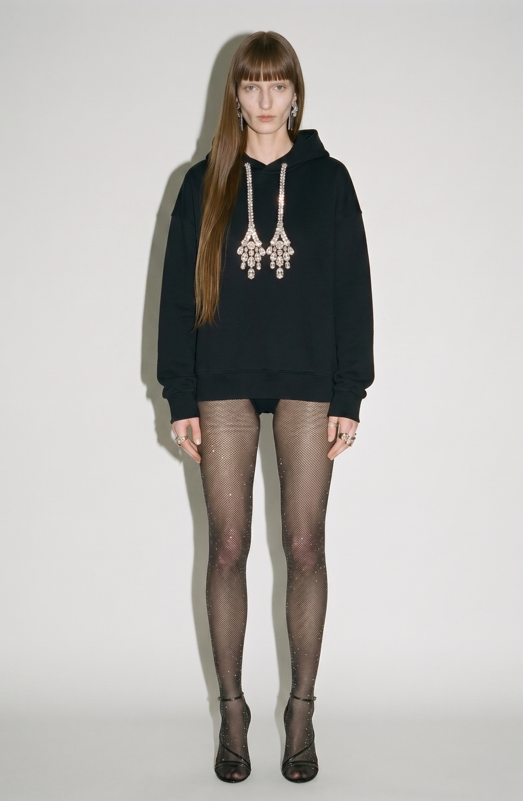 Women's black hoodie with crystal drawstring details and long sleeves