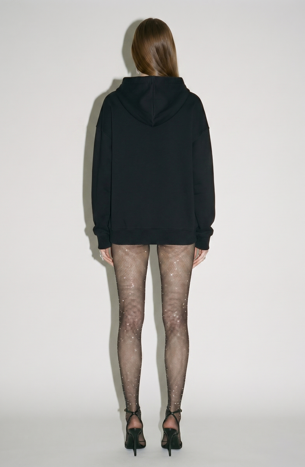 Women's black hoodie with crystal drawstring details and long sleeves