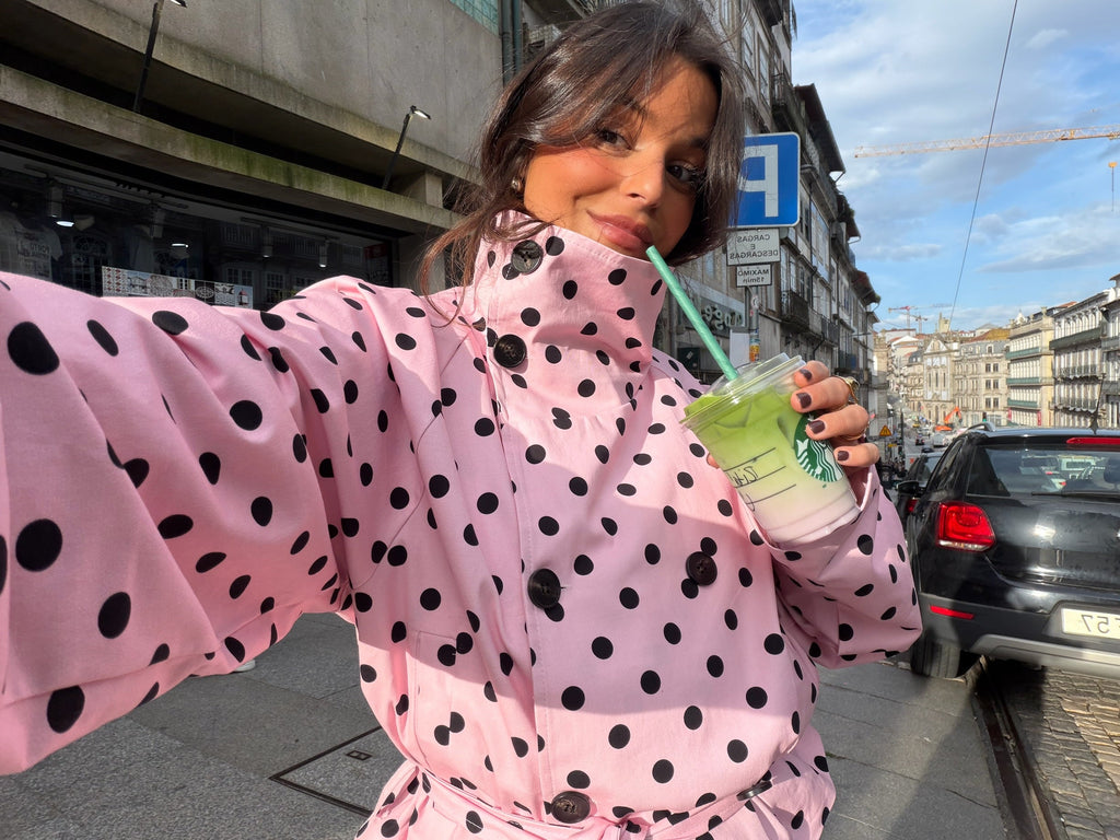 Women's pink cropped jacket with black polka dots, high collar and tie waist