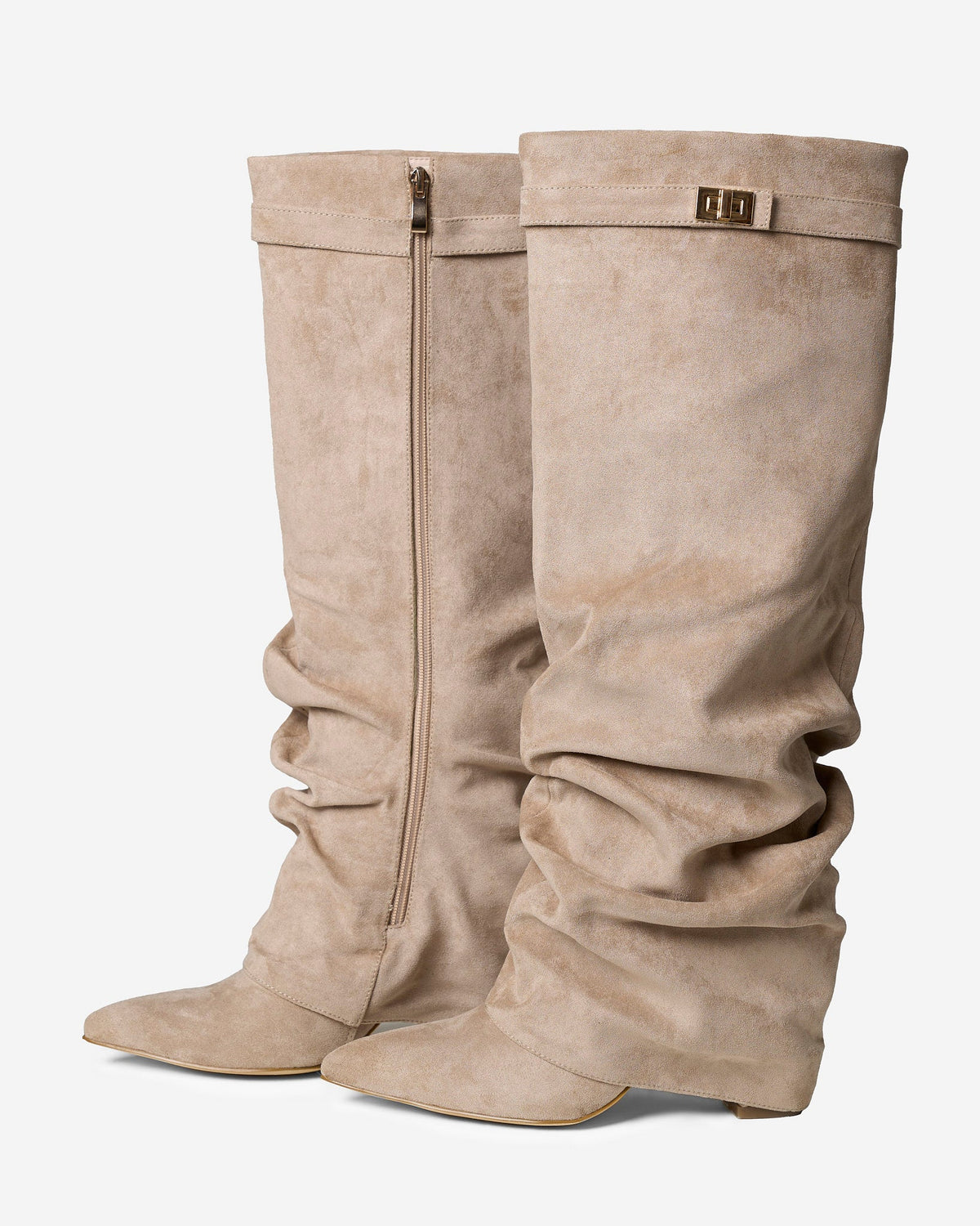 Women's beige slouchy knee-high boots with pointed toes, low heels and buckle straps