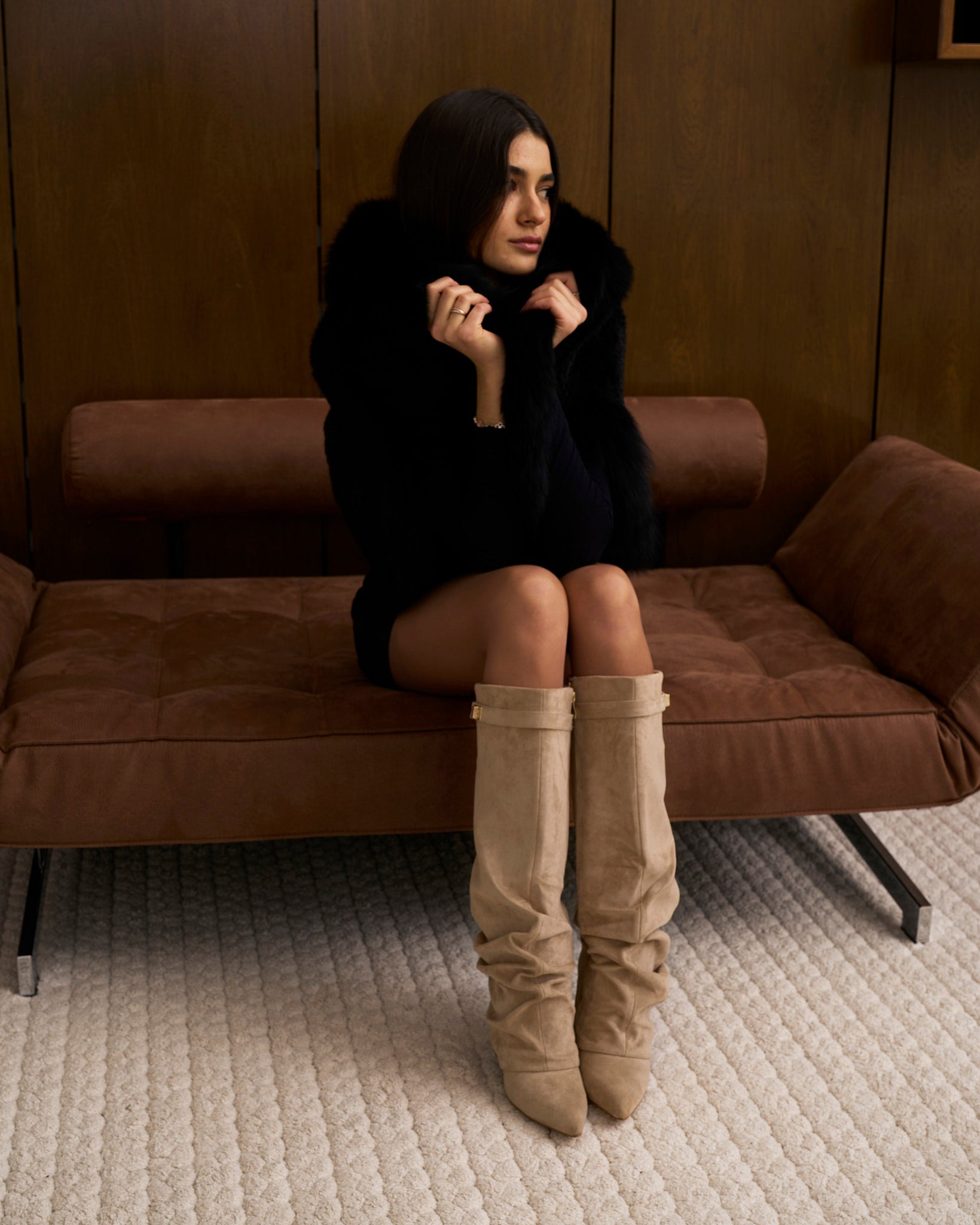 Women's beige slouchy knee-high boots with pointed toes, low heels and buckle straps