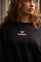 Women's black crewneck sweatshirt with pink butterfly logo and long sleeves