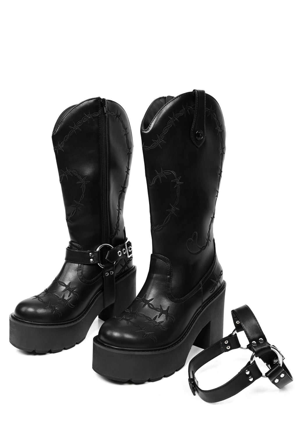 Black platform cowboy boots with barbed wire stitching and buckle straps