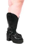 Black platform cowboy boots with barbed wire stitching and buckle straps