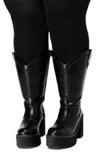 Black platform cowboy boots with barbed wire stitching and buckle straps