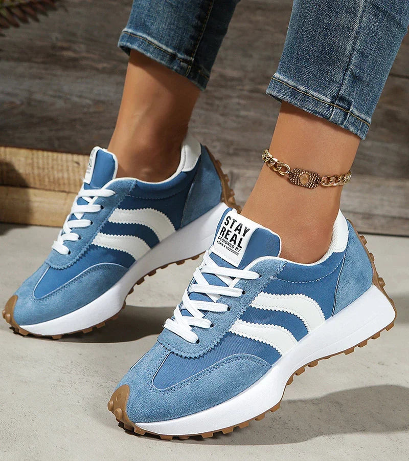 Women's panelled lace-up trainers with contrasting side stripes and raised white soles