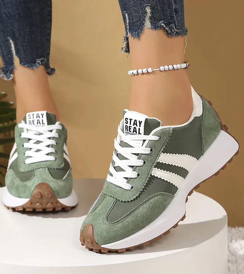 Women's panelled lace-up trainers with contrasting side stripes and raised white soles