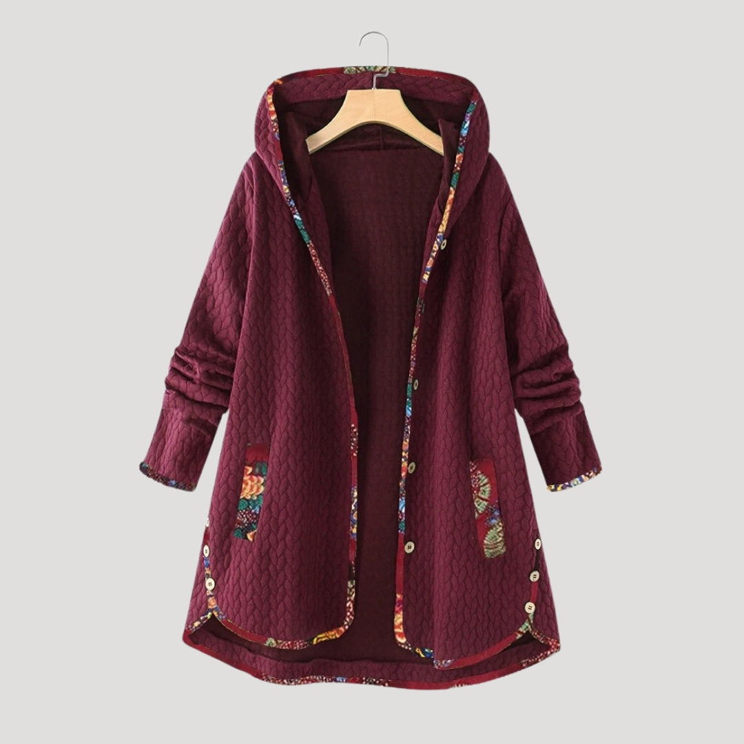 Women's long hooded quilted winter coat with button front and patch pockets