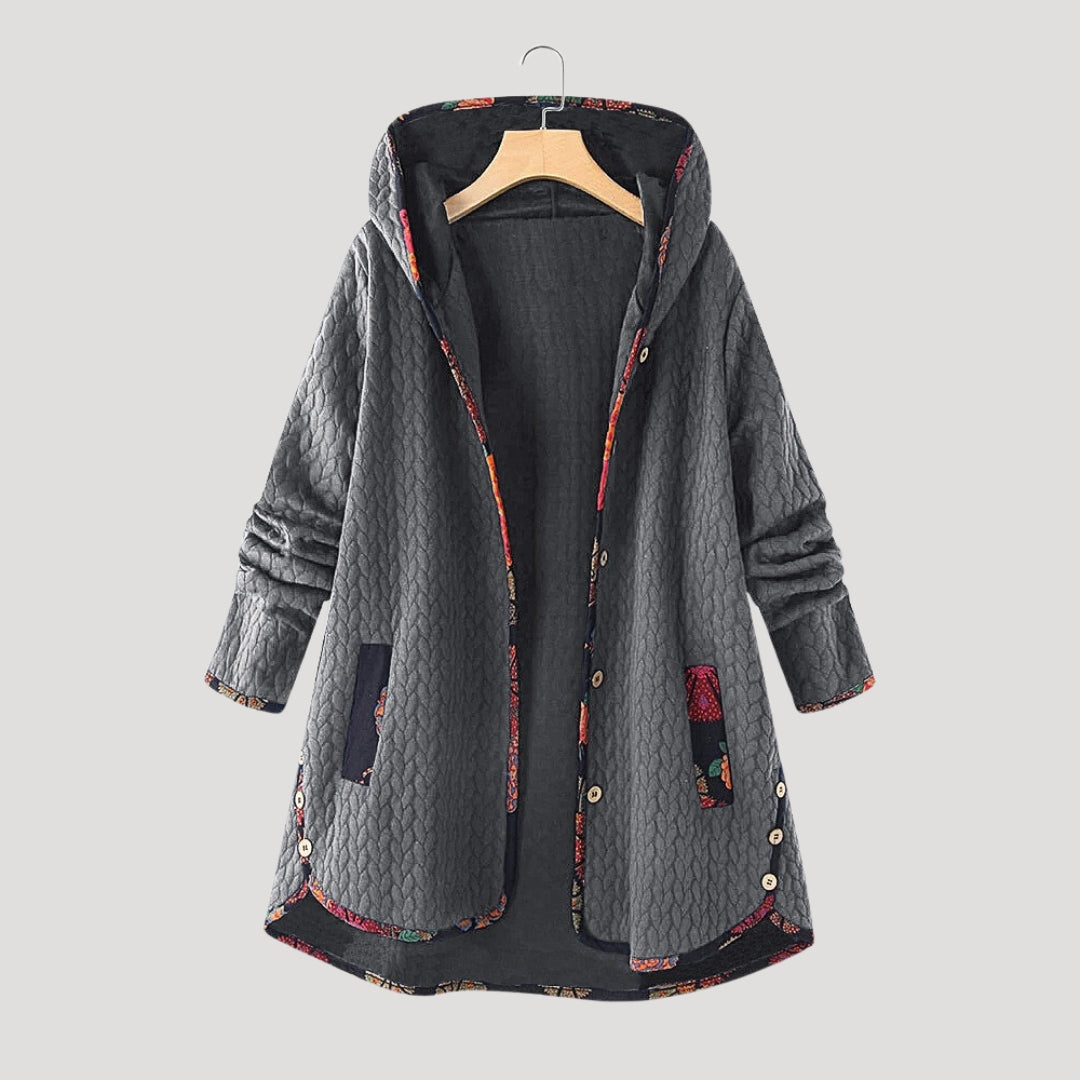 Women's long hooded quilted winter coat with button front and patch pockets