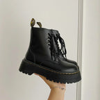 Women's black lace-up combat boots with chunky platform soles
