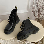 Women's black lace-up combat boots with chunky platform soles