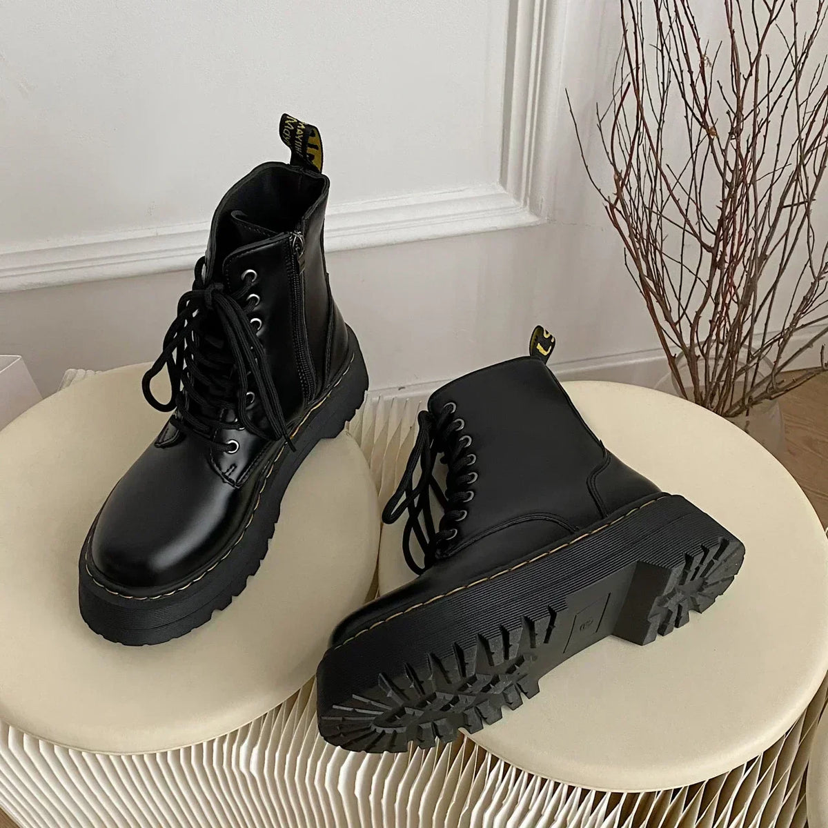Women's black lace-up combat boots with chunky platform soles