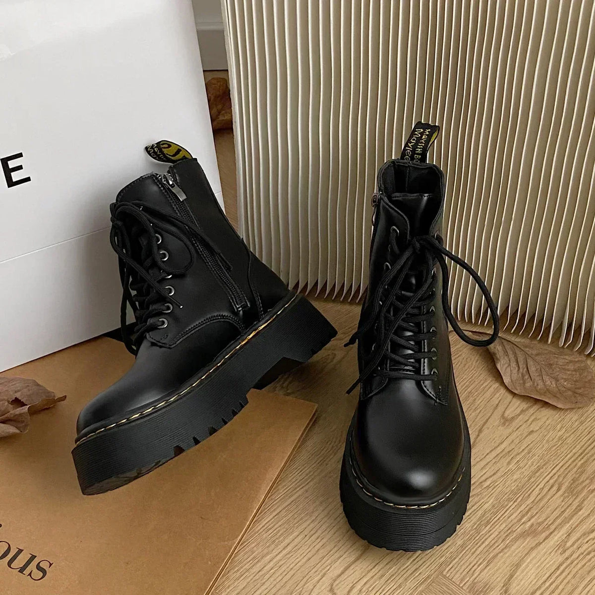 Women's black lace-up combat boots with chunky platform soles