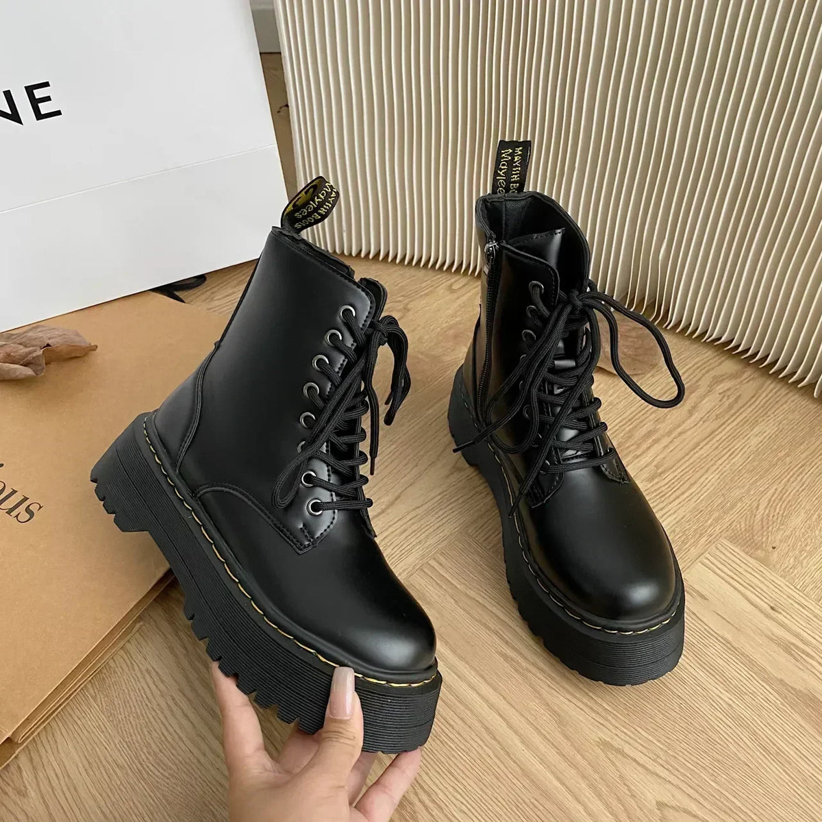 Women's black lace-up combat boots with chunky platform soles