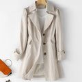 Women's tailored trench coat with notched lapels, long sleeves and flap pockets