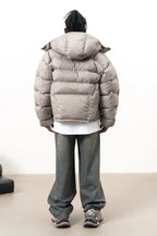 Men's stone hooded puffer jacket with quilted sections and front zip