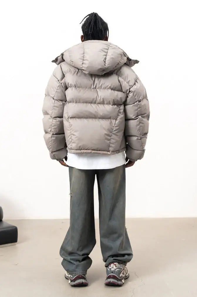 Men's stone hooded puffer jacket with quilted sections and front zip