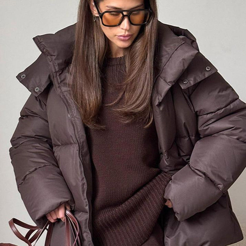 Women's hooded quilted puffer winter jacket with long sleeves and front zip