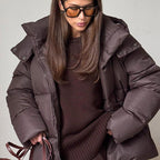 Women's hooded quilted puffer winter jacket with long sleeves and front zip