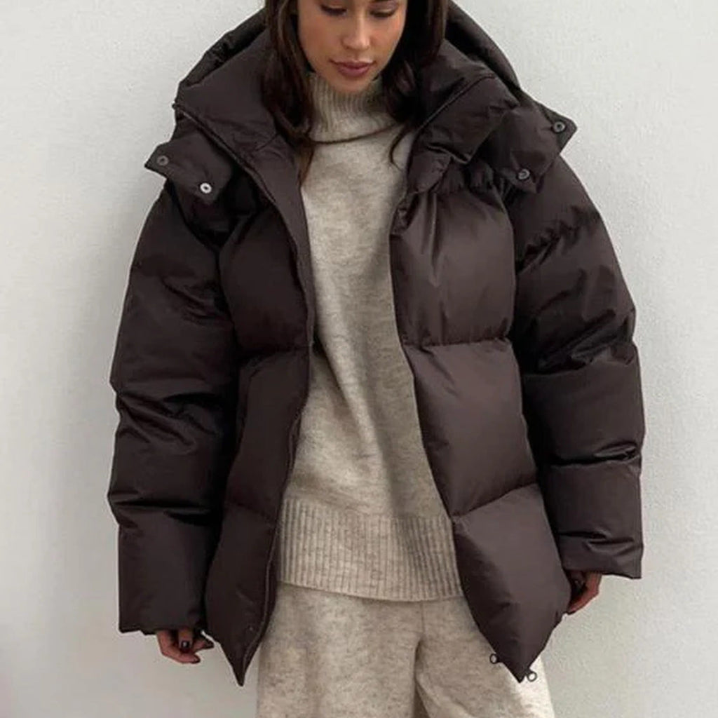 Women's hooded quilted puffer winter jacket with long sleeves and front zip