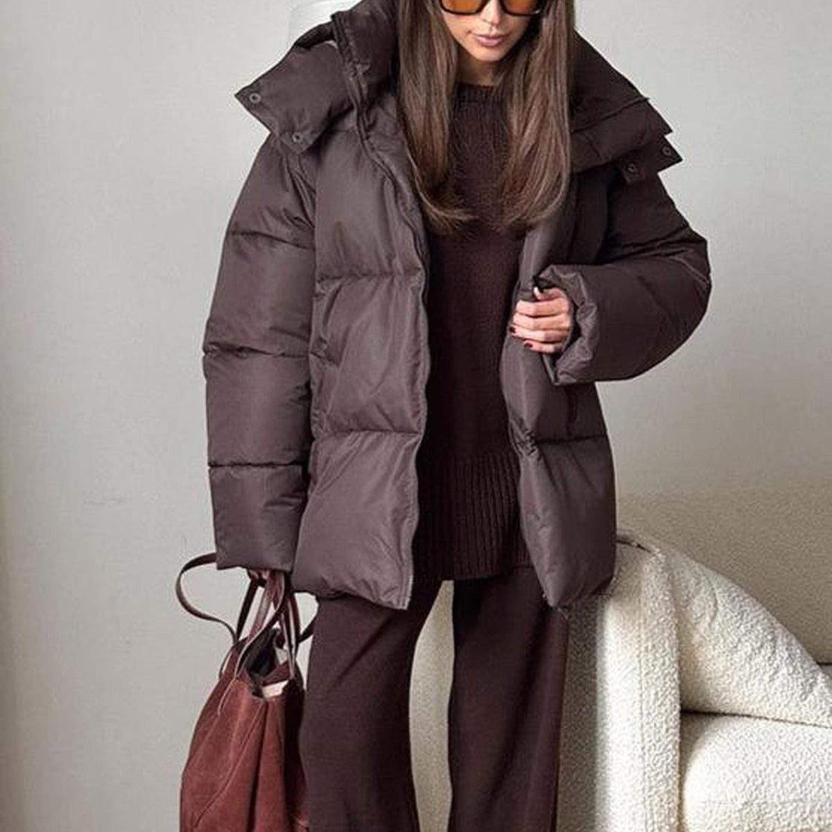 Women's hooded quilted puffer winter jacket with long sleeves and front zip