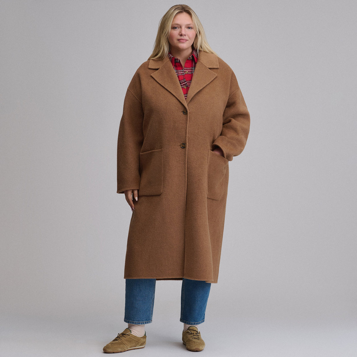 Women's camel long coat with notched lapels, button front and patch pockets