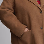 Women's camel long coat with notched lapels, button front and patch pockets