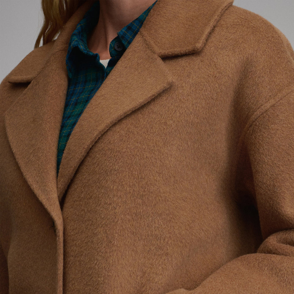 Women's camel long coat with notched lapels, button front and patch pockets