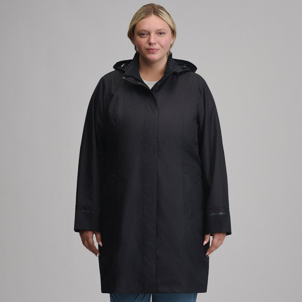 Women's long hooded waterproof trench coat with front zip and welt pockets