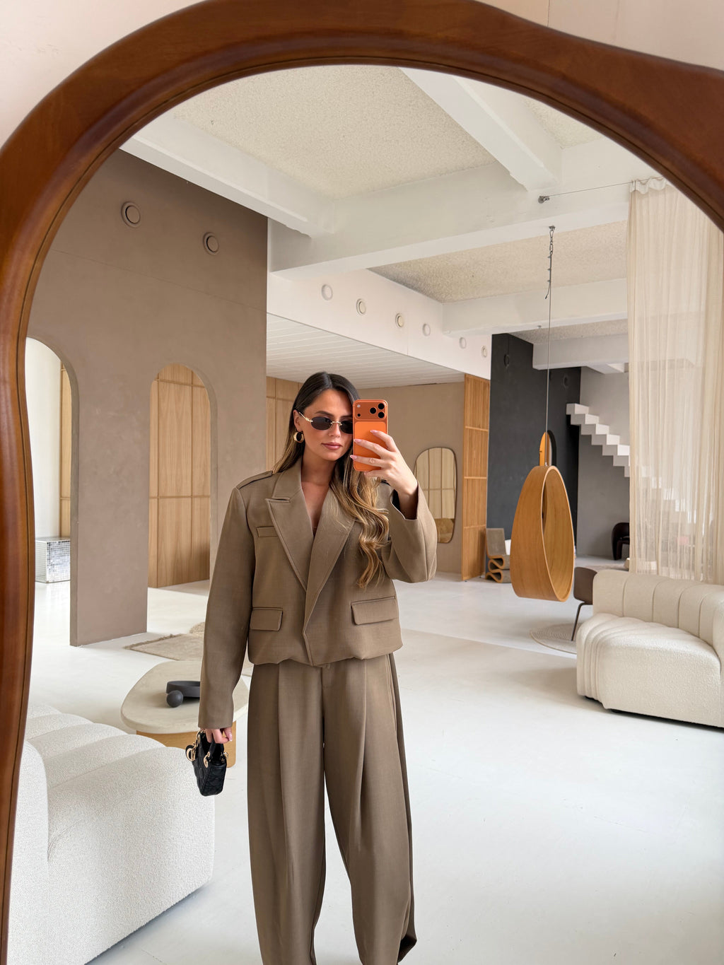 Women's taupe tailored blazer with notch lapels, long sleeves and flap pockets