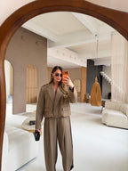 Women's taupe tailored blazer with notch lapels, long sleeves and flap pockets