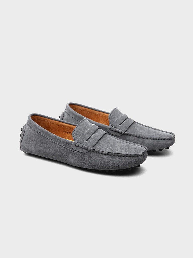 Suede boat loafers with moc toe stitching and slip-on strap detail