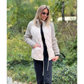 Women's quilted jacket with textured knitted sleeves, stand collar and zip front