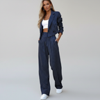 Women's striped trouser suit with cropped buttoned blazer and wide-leg trousers