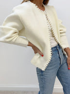 Women's open-front cardigan with pearl-style trim and long sleeves
