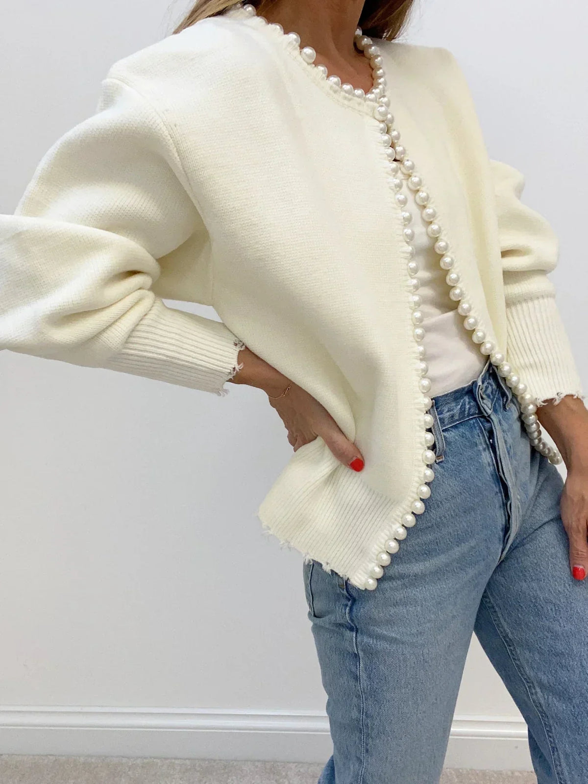 Women's open-front cardigan with pearl-style trim and long sleeves