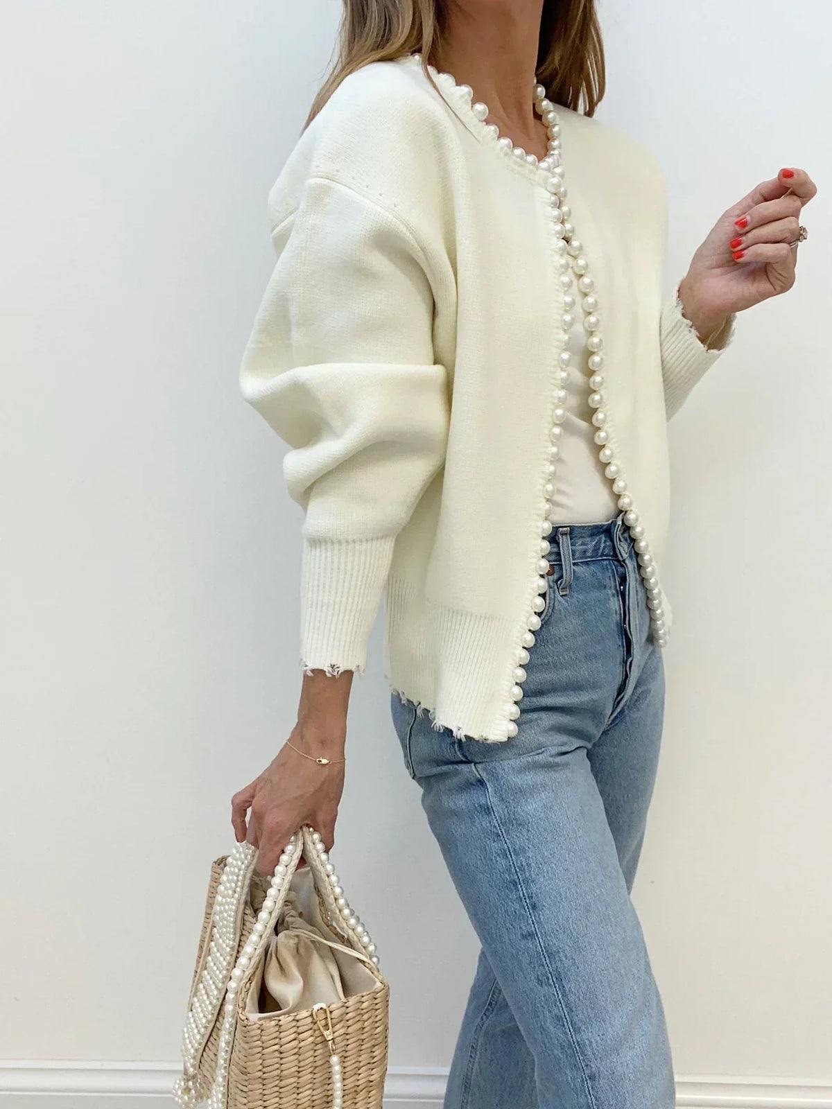 Women's open-front cardigan with pearl-style trim and long sleeves
