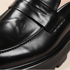Unisex penny loafers with chunky lug soles and slip-on design
