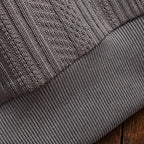 Men's long-sleeve textured polo sweater with collared neckline and button placket