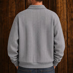 Men's long-sleeve textured polo sweater with collared neckline and button placket