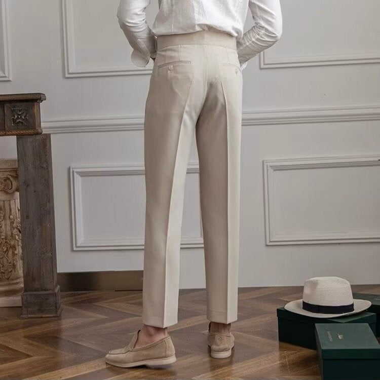 Women's high-waisted pleated straight-leg trousers with belt loops and long hems