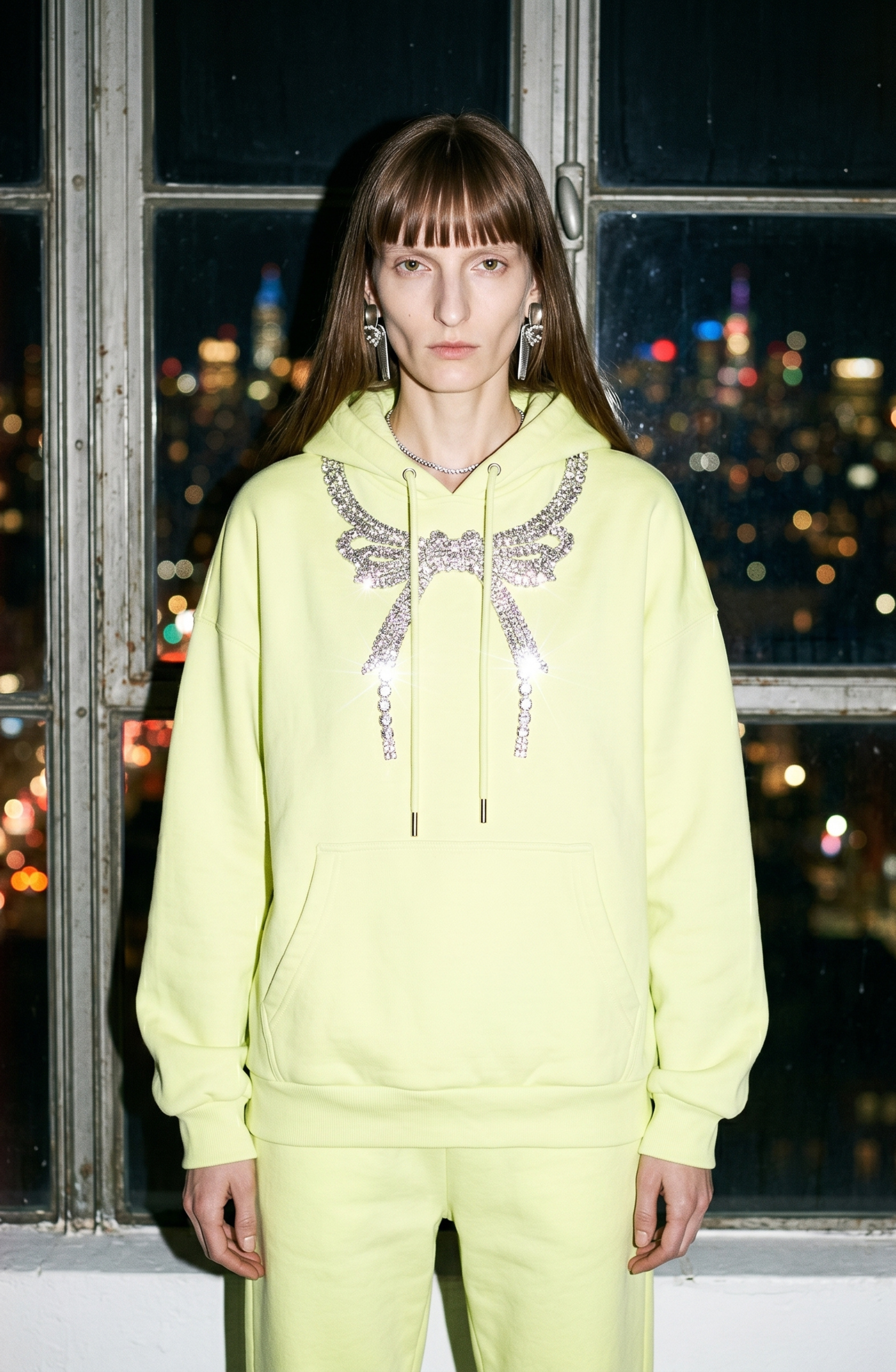 Black hoodie with embellished wing graphic, drawstring hood and kangaroo pocket