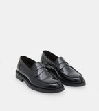 Men's glossy black penny loafers with rounded toes and low heels